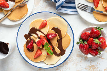 Pancakes with strawberry and chocolateの写真素材