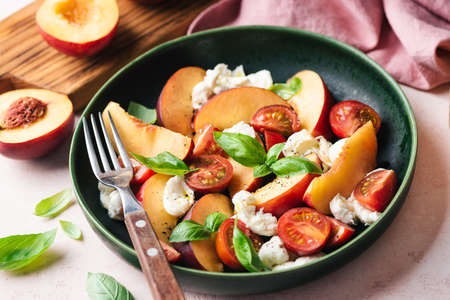 Healthy summer fruit and cheese saladの写真素材