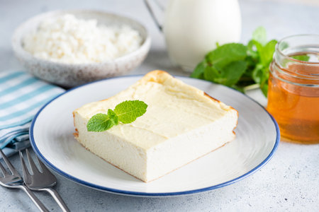 Bowl of granola with yogurt and blackberries in hands. Clean eating, dieting concept. top viewの写真素材