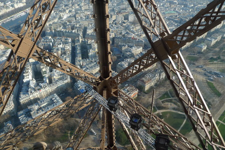 View through the metal structures on Paris from the Eiffel Towerの写真素材