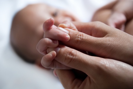 massage the baby's handの写真素材