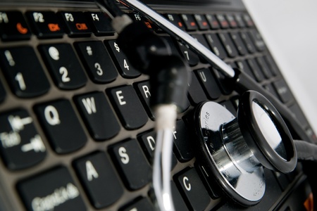 black stethoscope and keyboardの写真素材