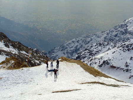 Laying on snow in the mountain with Great sun beam in sky during high school camping "Tehran, Iran - Jan 27 2014"のeditorial素材