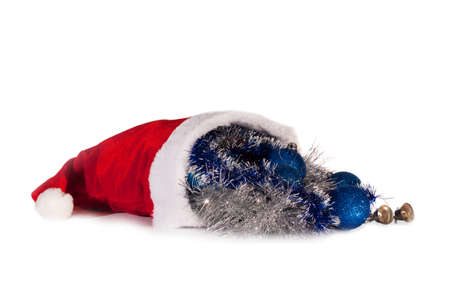 Santa Claus hat cap full christmas presents isolated on white backgroundの写真素材