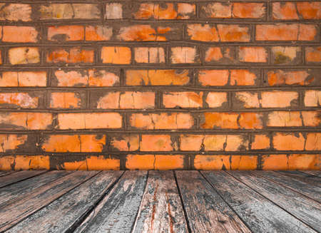 room interior vintage with orange brick wall and wood floor backgroundの写真素材