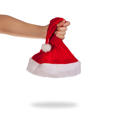 Woman hands holding santa hat. Isolated on white.の写真素材
