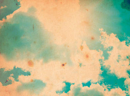 grunge image of blue sky with cloudsの写真素材