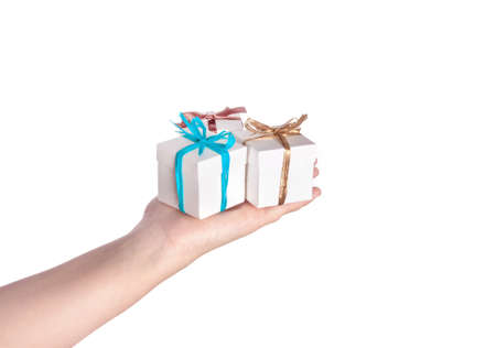 A hand holding a small white box isolated on white backgroundの写真素材