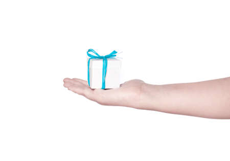 A hand holding a small white box isolated on white backgroundの写真素材