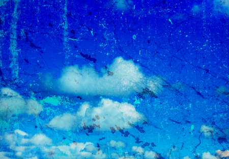 grunge image of blue sky with cloudsの写真素材
