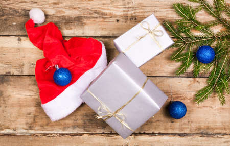 Christmas decoration with presents on wood boardの写真素材
