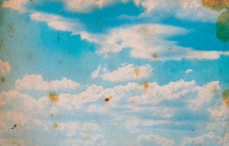 grunge image of blue sky with cloudsの写真素材