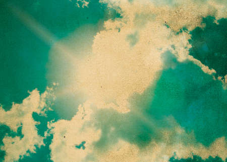 grunge image of blue sky with cloudsの写真素材
