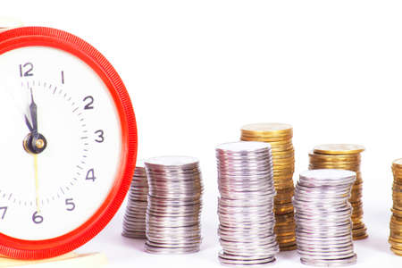 Alarm clock and money isolated on white