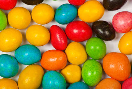 Close up of a pile of colorful chocolate coated candyの写真素材