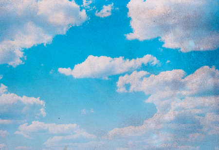 Retro blue sky background with tiny cloudsの写真素材