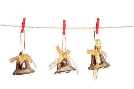 Vintage Christmas bells hanging on string isolated on white backgroundの写真素材