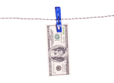 One hundred dollar bills hanging on a clothes pinsの写真素材