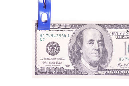 Dollar bills hanging on rope attached with clothes pins. Money-laundering concept.の写真素材