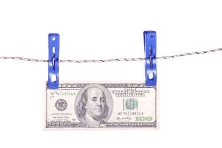 One hundred dollar bills hanging on a clothes pinsの写真素材