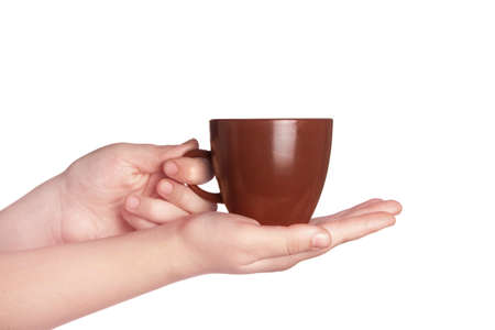 Brown cup of coffee in handの写真素材