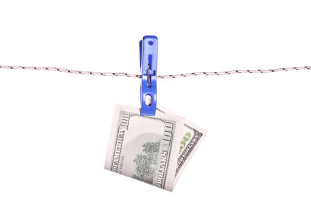 One hundred dollar bills hanging on a clothes pinsの写真素材