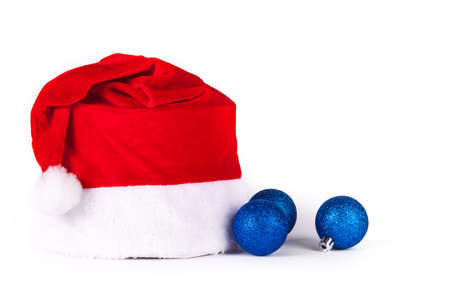 Christmas decorations with red hat on white backgroundの写真素材