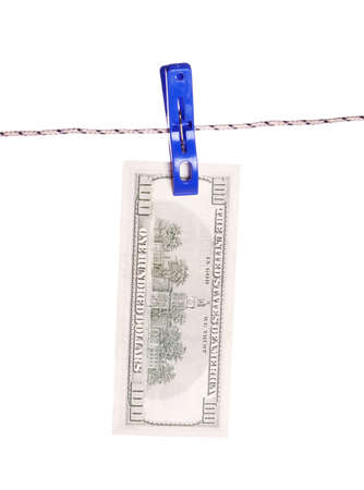 One hundred dollar bills hanging on a clothes pinsの写真素材