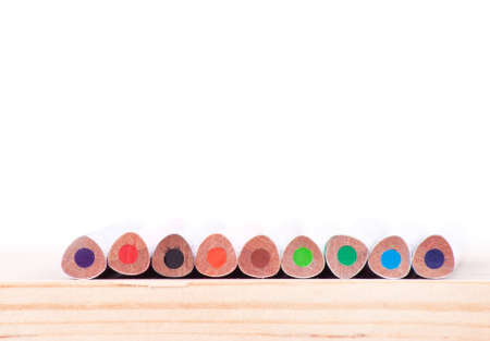 colored pencils on the wooden table close-upの写真素材