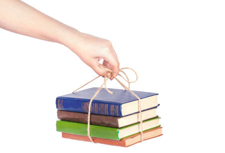 hand giving pile of book as a gift of knowledgeの写真素材