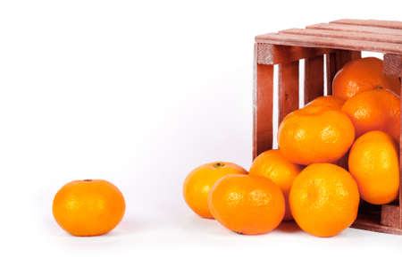 Mandarin in an old box on a white background.の写真素材