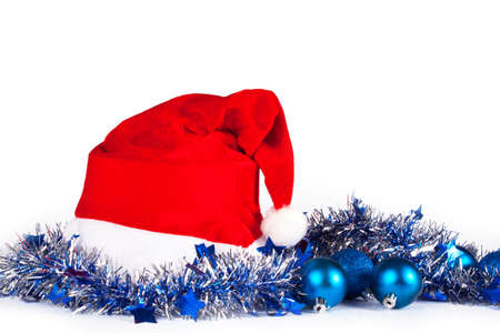 Christmas decorations with santa hat on whiteの写真素材