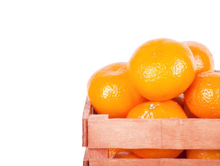 Mandarin in an old box on a white background.の写真素材