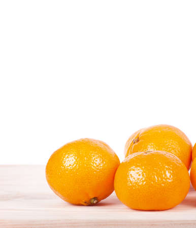 A mandarine on wooden table. Empty copy space for editor's text.の写真素材