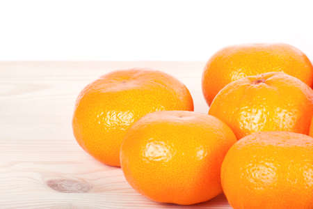 A mandarine on wooden table. Empty copy space for editor's text.の写真素材