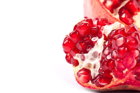 Ripe pomegranate fruit with half isolated on white backgroundの写真素材