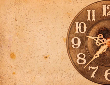 Close up of a clock isolated ob blue background with copy spaceの写真素材