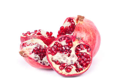 Ripe pomegranate fruit with half isolated on white backgroundの写真素材