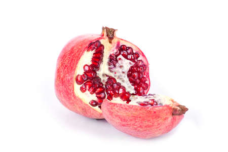 Ripe pomegranate fruit with half isolated on white backgroundの写真素材