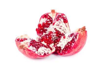 Ripe pomegranate fruit with half isolated on white backgroundの写真素材
