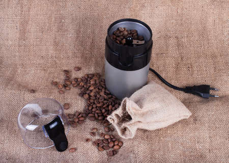 still life with coffee beans and  coffee mill on the wooden backgroundの写真素材