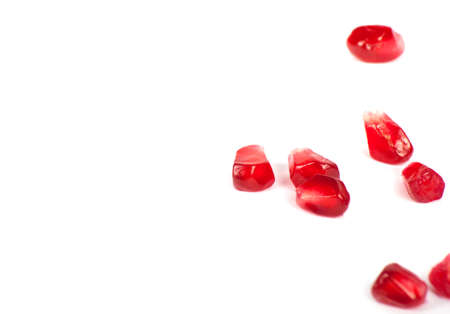 Ripe pomegranate fruit with half isolated on white backgroundの写真素材