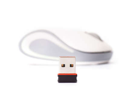 Wireless computer mouse with small radio receiver on white backgroundの写真素材