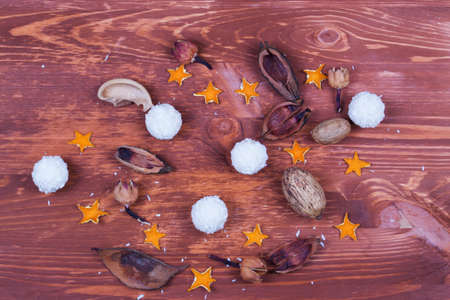 Christmas background with snowflakes and decoration on wooden table. Copy space. Top view