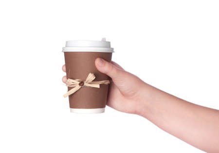 disposable cup of coffee in hand isolated on white backgroundの写真素材