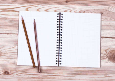 brown blank note book on grunge woodの写真素材