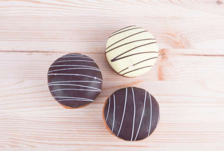 cake with chocolate fudge on a wooden boardの写真素材