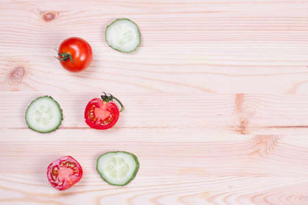 vegetables for salad on a wooden boardの写真素材