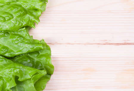 fresh green lettuce on wooden tableの写真素材