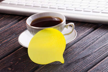 Coffee and card on wood backgroundの写真素材